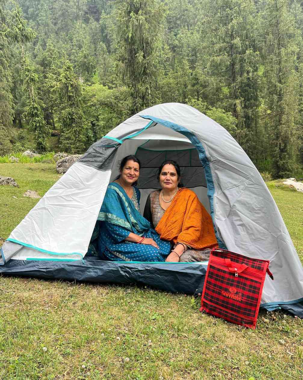 two lady tourists inside the rental tent offered by seraj camping 1724483029